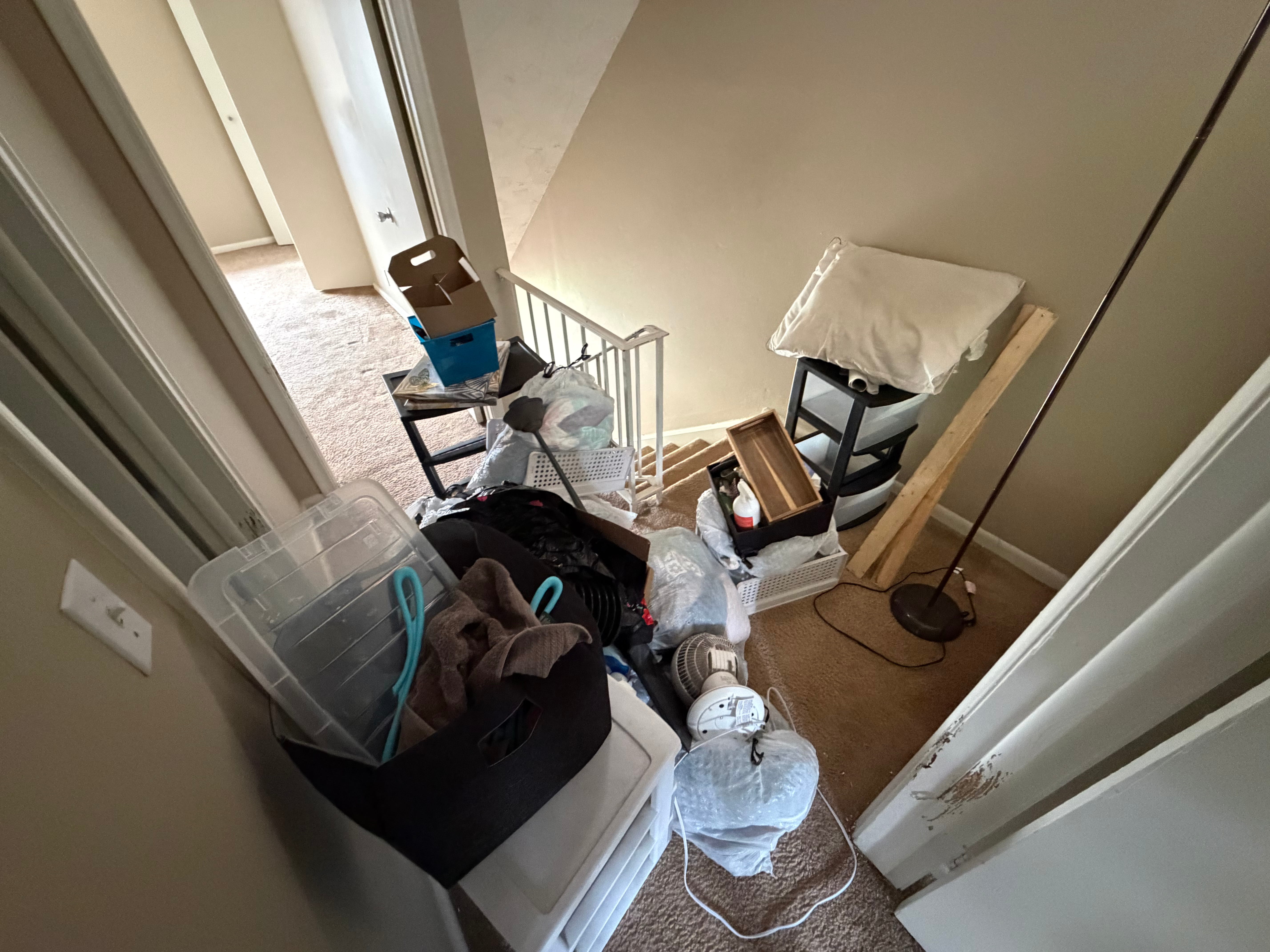 Before junk removal — cluttered space full of items