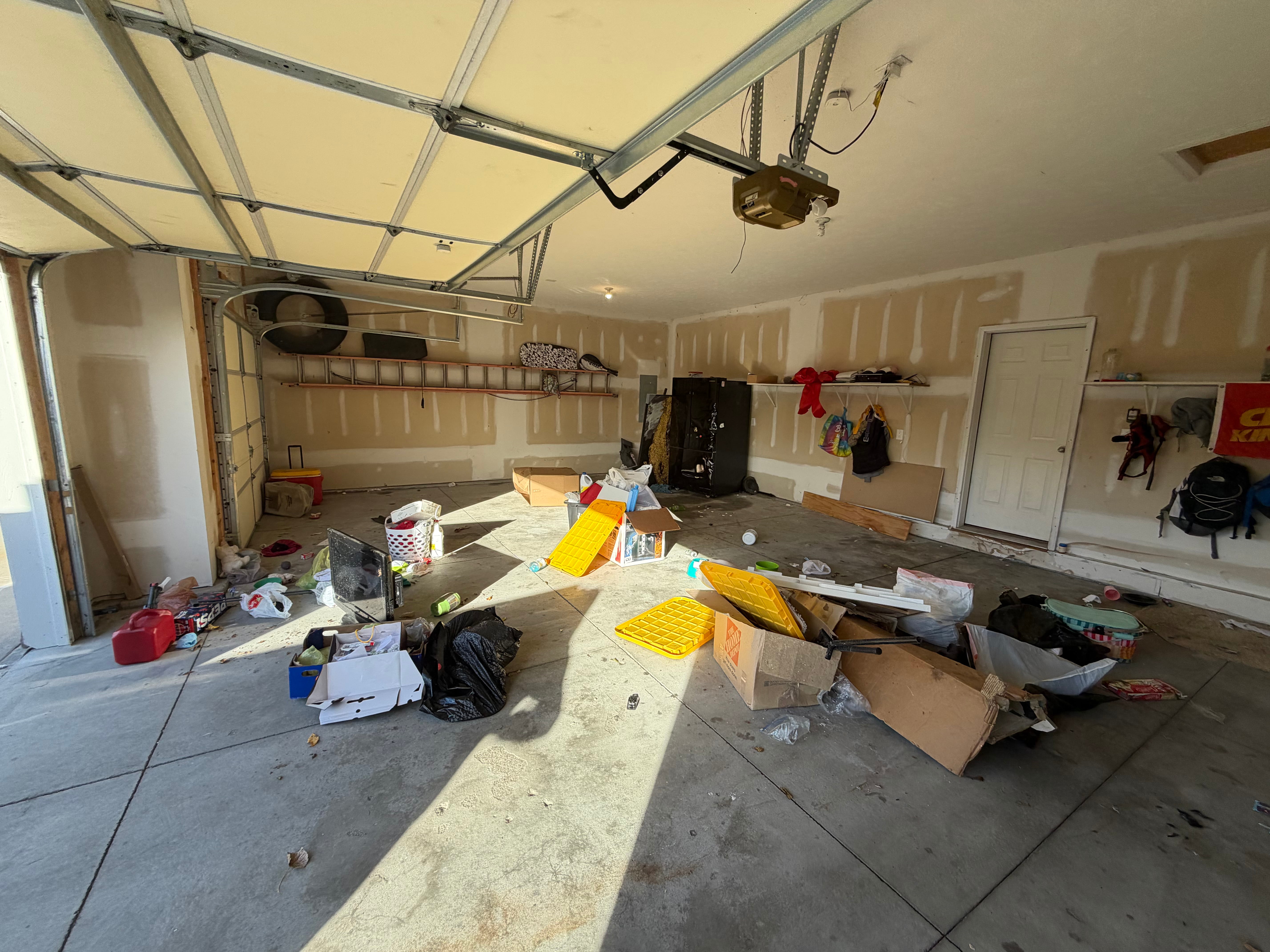 Before property cleanout — packed full of furniture and belongings